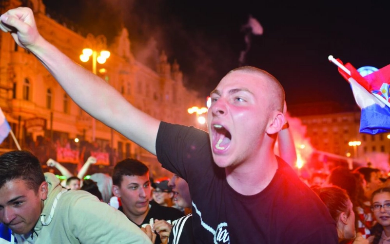 epa06882368 Supporters of Croatia celebrate as they watch the broadcast of the FIFA World Cup 2018 semi final match between Croatia and England in central Zagreb, Croatia, 11 July 2018. Croatia won 2-1. EPA/STR