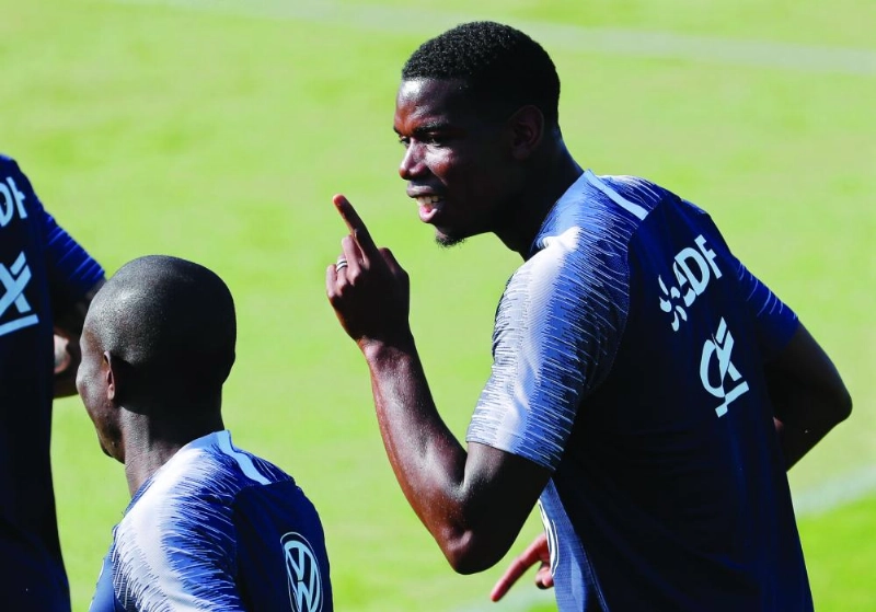 epa06884028 France's Paul Pogba (R) attends his team's training session in Istra, outside Moscow, Russia, 12 July 2018. France will face Croatia in their FIFA World Cup 2018 final in Moscow on 15 July 2018. EPA/SERGEI ILNITSKY