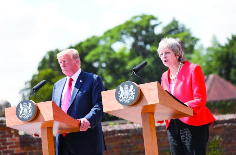 epa06886023 British Prime Minister Theresa May (R) and US President Donald J. Trump (L) attend a joint news conference after their bilateral meeting at Chequers in Aylesbury, Britain, 13 July 2018. US President Trump is on a three-day working visit to the United Kingdom, first trip to the country as US president. EPA/CHRIS RATCLIFFE / POOL