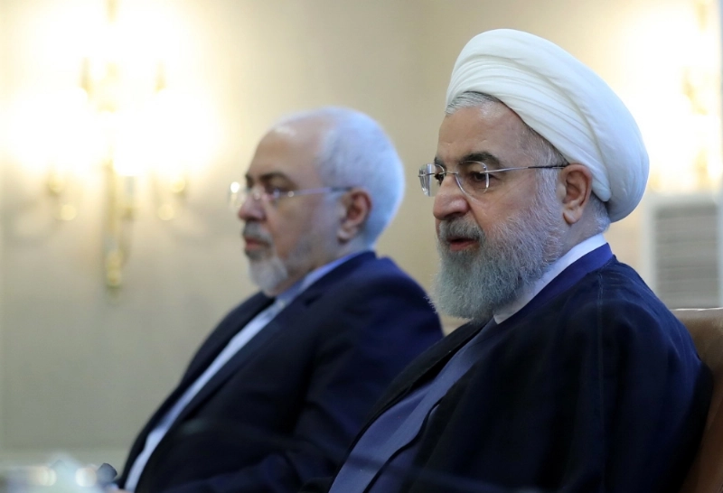 epa06903836 A handout photo made available by the Iran's Presidential office shows Iranian President Hassan Rouhani (R) and Foreign Minister Mohammad Javad Zarif (L) during a ceremony in Tehran, Iran, 22 July 2018. Media cited Rouhani threatening the US and its president Donlad J. Trump over possible plans to block oil export routes in the Persian Gulf by saying 'Do not play with the lion's tail'. EPA/PRESIDENTIAL OFFICE HANDOUT HANDOUT EDITORIAL USE ONLY/NO SALES