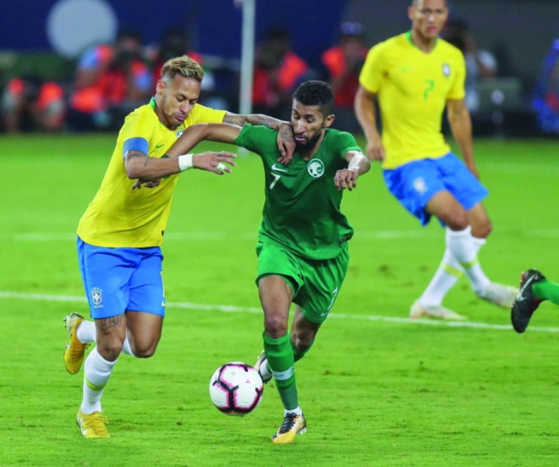 الفرج ونيمار خلال مباراة السعودية والبرازيل (الاتحاد السعودي)