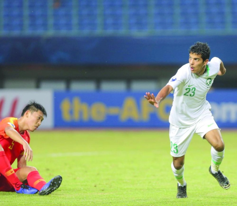 القحطاني محتفلا بهدفه في الصين أمس (الاتحاد السعودي)