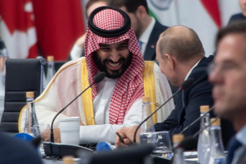 30 November 2018, Argentina, Buenos Aires: Saudi Arabia's Crown Prince Mohammed bin Salman (L) and Russian President Vladimir Putin attend a plenary session at the G20 summit. Photo: Carlos Brigo/dpa