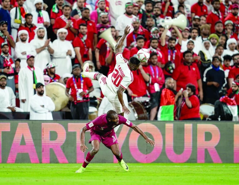 29 January 2019, United Arab Emirates, Abu Dhabi: UAE's Saif Rashid and Qatar's Abdelkarim Hassan battle for the ball during the AFC Asian cup semifinal soccer match between Qatar and UAE at Mohammed Bin Zayed Stadium. Photo: Ulrik Pedersen/CSM via ZUMA Wire/dpa