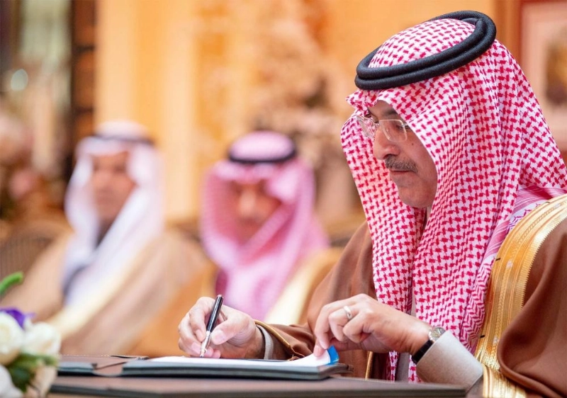 محمد الجدعان موقعا اتفاقية تجنب الازدواج الضريبي