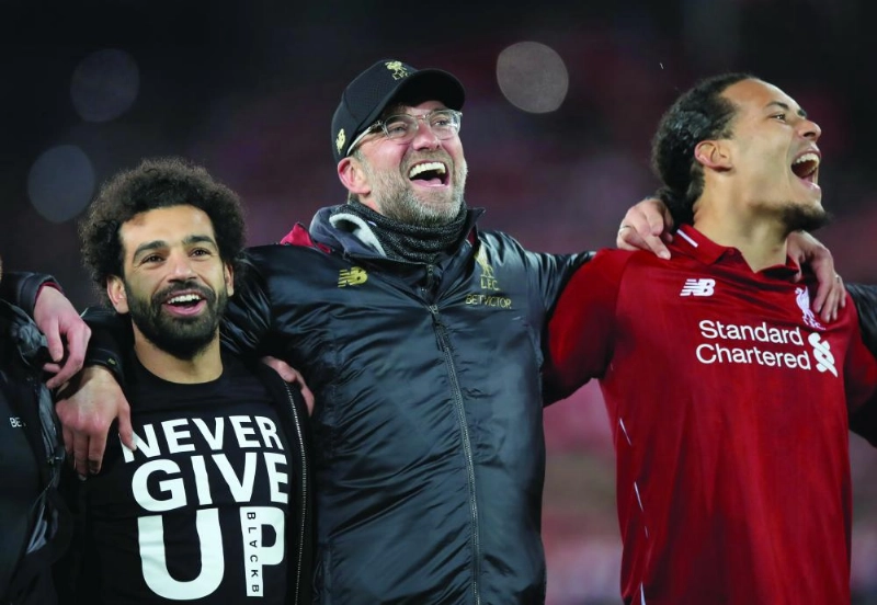 dpatop - 07 May 2019, England, Liverpool: Liverpool's Mohamed Salah (L), manager Jurgen Klopp (C) and Virgil van Dijk celebrate after the final whistle of the UEFA Champions League semi-final second leg soccer match between Liverpool and Barcelona at Anfield stadium. Photo: Peter Byrne/PA Wire/dpa