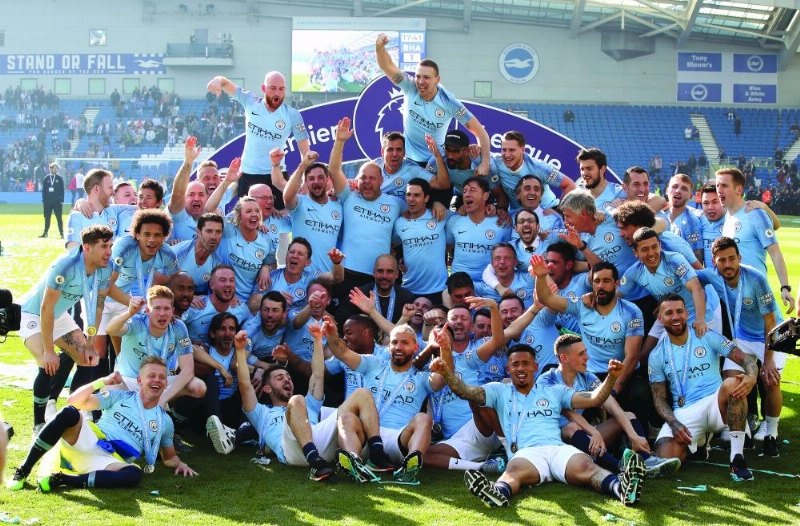 12 May 2019, England, Brighton: Manchester City players and staff celebrate winning the the Premier League after the English Premier League soccer match between Brighton & Hove Albion and Manchester City at the AMEX Stadium. Photo: Nick Potts/PA Wire/dpa