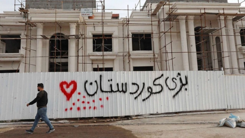 تهديد للميليشيات على جدار إحدى البنايات