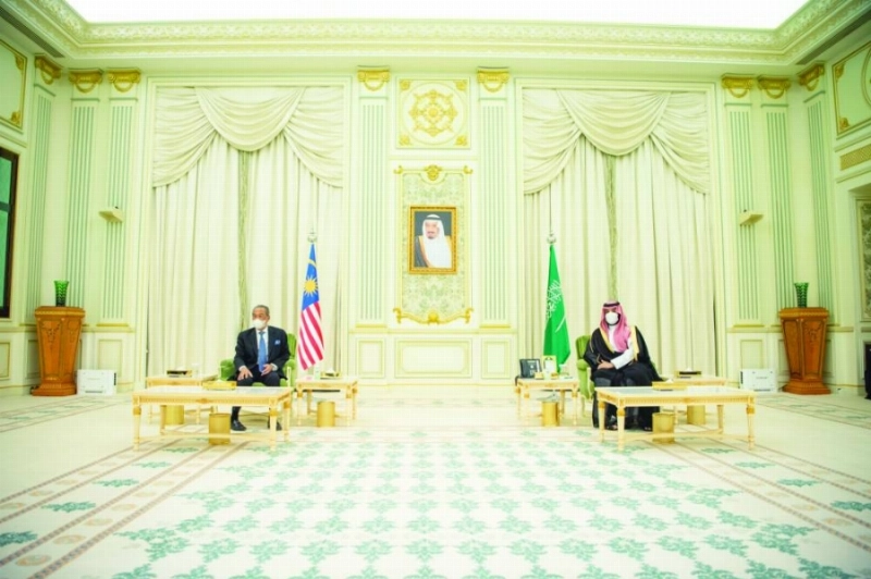 ولي العهد ورئيس وزراء ماليزيا خلال اللقاء