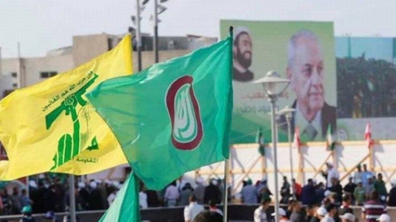 عناصر من حزب الله وحركة أمل في شوارع بيروت (مكة)