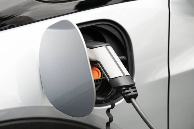 EV or Electric car at charging station plugged in