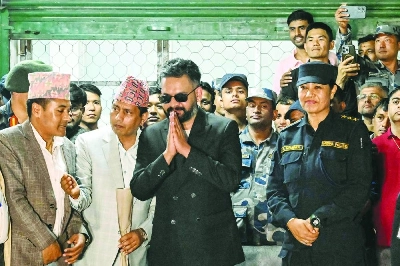 Rastriya Swatantra Party election candidate Balendra Shah (entre) greets supporters at the counting centre in Damak in Nepal's Jhapa district on Saturday. Rastriya Swatantra Party election candidate Balendra Shah (entre) greets supporters at the counting centre in Damak in Nepal's Jhapa district on Saturday.