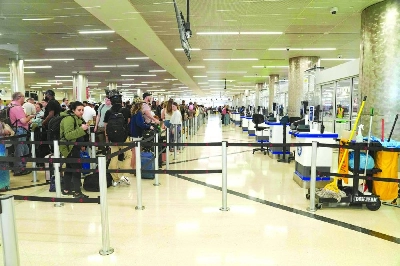 TSA desks sit empty as travellers stand in long lines at Atlanta Hartsfield-Jackson International Airport Sunday in Atlanta, Georgia. (AFP) TSA desks sit empty as travellers stand in long lines at Atlanta Hartsfield-Jackson International Airport Sunday in Atlanta, Georgia. (AFP)