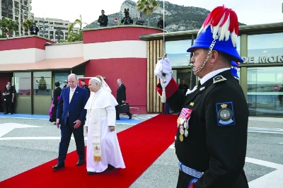 Albert II of Monaco (left) escorting Pope Leo XIV to his helicopter upon departure from Monaco Heliport in Monte Carlo, Monaco, Saturday. (AFP) Albert II of Monaco (left) escorting Pope Leo XIV to his helicopter upon departure from Monaco Heliport in Monte Carlo, Monaco, Saturday. (AFP)
