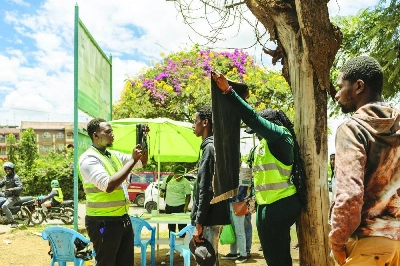 A young man has his biometrics captured in a makeshift setup by officials using a using a biometric voter registrations kit (BVR) at a pop-up registration centre for new voters during a mass voter registration drive by the national election regulator, Independent Electoral Boundaries Commission (IEBC) in the Kenyan capital Nairobi, Monday. (AFP) A young man has his biometrics captured in a makeshift setup by officials using a using a biometric voter registrations kit (BVR) at a pop-up registration centre for new voters during a mass voter registration drive by the national election regulator, Independent Electoral Boundaries Commission (IEBC) in the Kenyan capital Nairobi, Monday. (AFP)