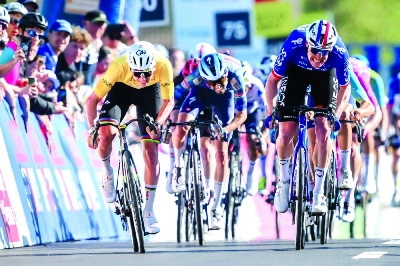 UAE Team Emirates-XRG’s Tadej Pogacar (left) sprints to win ahead of INEOS Grenadiers’ Dorion Godon (R), in Vucherens, Switzerland, (AFP)
UAE Team Emirates-XRG’s Tadej Pogacar (left) sprints to win ahead of INEOS Grenadiers’ Dorion Godon (R), in Vucherens, Switzerland, (AFP)