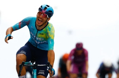XDS Astana Team Italian rider Davide Ballerini celebrates as he crosses the finish line to win in the 6th stage of the Giro d'Italia in Naples, Italy, on May 14, 2026. (AFP) XDS Astana Team Italian rider Davide Ballerini celebrates as he crosses the finish line to win in the 6th stage of the Giro d'Italia in Naples, Italy, on May 14, 2026. (AFP)
