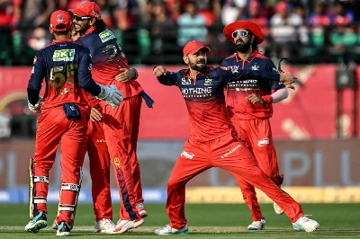 Royal Challengers Bengaluru's Virat Kohli (second right) celebrates with team-mates after the dismissal of Punjab Kings' captain Shreyas Iyer during the Indian Premier League (IPL) T20 match at the Himachal Pradesh Cricket Association Stadium in Dharamsala, India. (AFP) Royal Challengers Bengaluru's Virat Kohli (second right) celebrates with team-mates after the dismissal of Punjab Kings' captain Shreyas Iyer during the Indian Premier League (IPL) T20 match at the Himachal Pradesh Cricket Association Stadium in Dharamsala, India. (AFP)