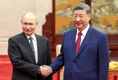 Russian President Vladimir Putin and Chinese President Xi Jinping shake hands as they pose for photos before a tea ceremony following their meeting at the Great Hall of the People in Beijing, China May 20, 2026. Sputnik/Alexander Kazakov/Pool via Reuters ATTENTION EDITORS — THIS IMAGE WAS PROVIDED BY A THIRD PARTY. Russian President Vladimir Putin and Chinese President Xi Jinping shake hands as they pose for photos before a tea ceremony following their meeting at the Great Hall of the People in Beijing, China May 20, 2026. Sputnik/Alexander Kazakov/Pool via Reuters ATTENTION EDITORS — THIS IMAGE WAS PROVIDED BY A THIRD PARTY.