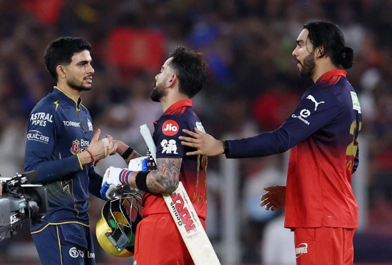 Royal Challengers Bengaluru's Virat Kohli shakes hands with Gujarat Titans' Shubman Gill after winning the Indian Premier League. (Reuters) Royal Challengers Bengaluru's Virat Kohli shakes hands with Gujarat Titans' Shubman Gill after winning the Indian Premier League. (Reuters)