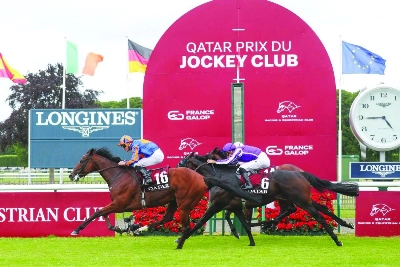 Ryan Moore rides Constitution River to victory in the QREC-sponsored Qatar Prix du Jockey Club in France. Ryan Moore rides Constitution River to victory in the QREC-sponsored Qatar Prix du Jockey Club in France.