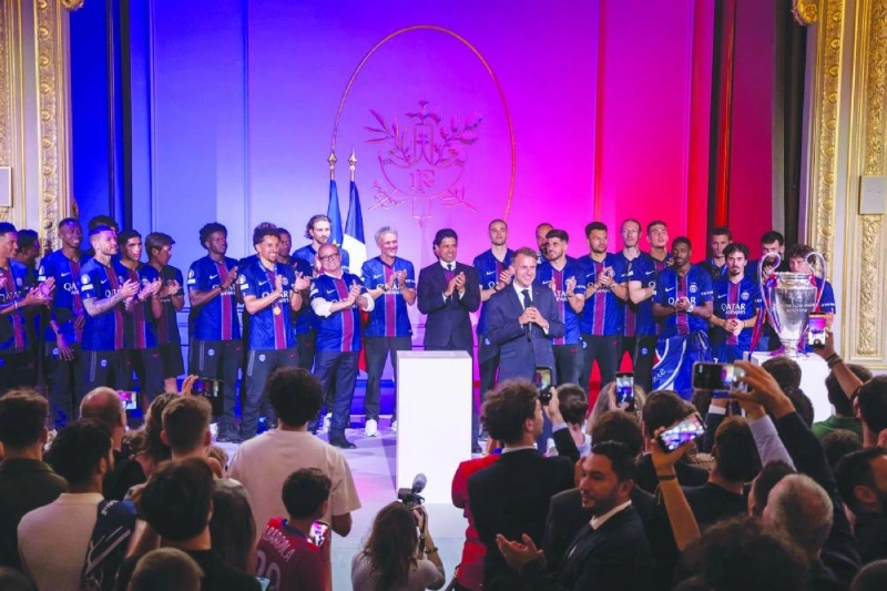 France's President Emmanuel Macron (centre) delivers a speech as during an event with Paris Saint-Germain's (PSG) players to celebrate their victory over Arsenal in the UEFA Champions League final, at the Elysee Palace in Paris on May 31, 2026. PSG claimed back-to-back Champions League triumphs with a 4-3 shoot-out win over Arsenal following a 1-1 draw after extra time on May 30, 2026. (AFP) France's President Emmanuel Macron (centre) delivers a speech as during an event with Paris Saint-Germain's (PSG) players to celebrate their victory over Arsenal in the UEFA Champions League final, at the Elysee Palace in Paris on May 31, 2026. PSG claimed back-to-back Champions League triumphs with a 4-3 shoot-out win over Arsenal following a 1-1 draw after extra time on May 30, 2026. (AFP)