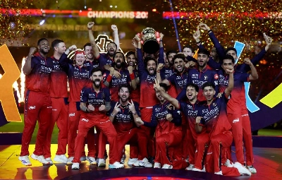 Royal Challengers Bengaluru's Rajat Patidar lifts the trophy as he celebrates with teammates after winning the Indian Premier League. (Reuters) Royal Challengers Bengaluru's Rajat Patidar lifts the trophy as he celebrates with teammates after winning the Indian Premier League. (Reuters)