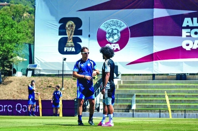 Qatar coach Julen Lopetegui speaks to star forward Akram Afif during a training session in Santa Barbara, California. Qatar coach Julen Lopetegui speaks to star forward Akram Afif during a training session in Santa Barbara, California.