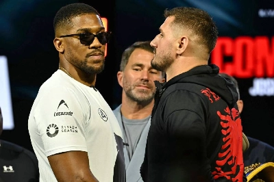Albania's Kristian Prenga (right) and Britain's Anthony Joshua (left) pose with promoter Eddie Hearn at a press conference in London ahead of their fight in Saudi Arabia in July. (AFP) Albania's Kristian Prenga (right) and Britain's Anthony Joshua (left) pose with promoter Eddie Hearn at a press conference in London ahead of their fight in Saudi Arabia in July. (AFP)