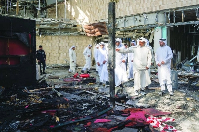 Kuwaiti Prime Minister Sheikh Ahmad al-Abdullah al-Sabah (second right) inspecting the damaged airport after the attack in Kuwait City. (AFP) Kuwaiti Prime Minister Sheikh Ahmad al-Abdullah al-Sabah (second right) inspecting the damaged airport after the attack in Kuwait City. (AFP)
