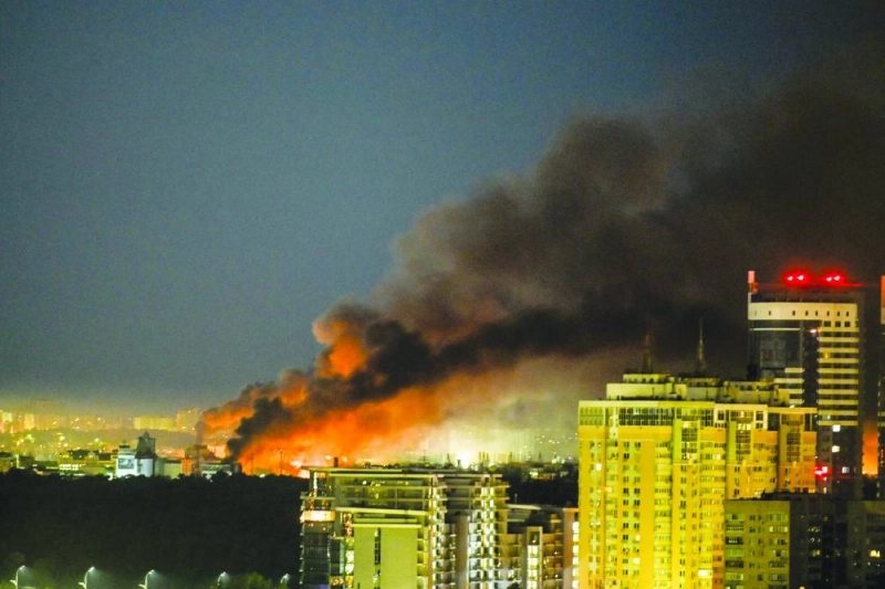 Smoke billowing from a fire during drone and missile attacks in Kyiv on Wednesday. Russian missile and drone barrages rocked parts of Ukraine, killing four and wounding dozens, officials said on June 2, the latest attacks in a war with no end in sight. (AFP)
Smoke billowing from a fire during drone and missile attacks in Kyiv on Wednesday. Russian missile and drone barrages rocked parts of Ukraine, killing four and wounding dozens, officials said on June 2, the latest attacks in a war with no end in sight. (AFP)