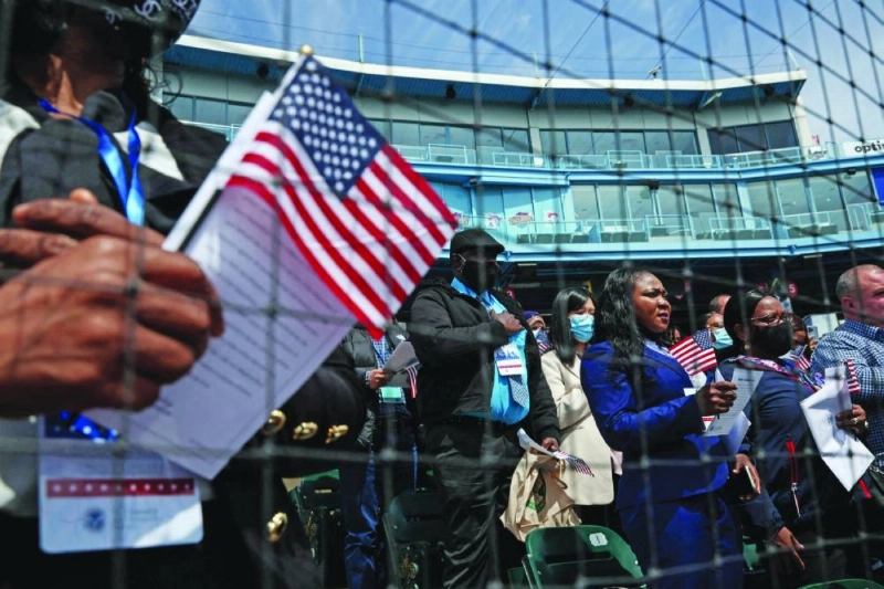 FILE PHOTO: Citizen candidates attend a U.S. Citizenship and Immigration Services (USCIS) naturalization ceremony at the Brooklyn Cyclones Maimonides Park in the Brooklyn borough of New York City, U.S. May 3, 2022. REUTERS/Shannon Stapleton/File Photo FILE PHOTO: Citizen candidates attend a U.S. Citizenship and Immigration Services (USCIS) naturalization ceremony at the Brooklyn Cyclones Maimonides Park in the Brooklyn borough of New York City, U.S. May 3, 2022. REUTERS/Shannon Stapleton/File Photo