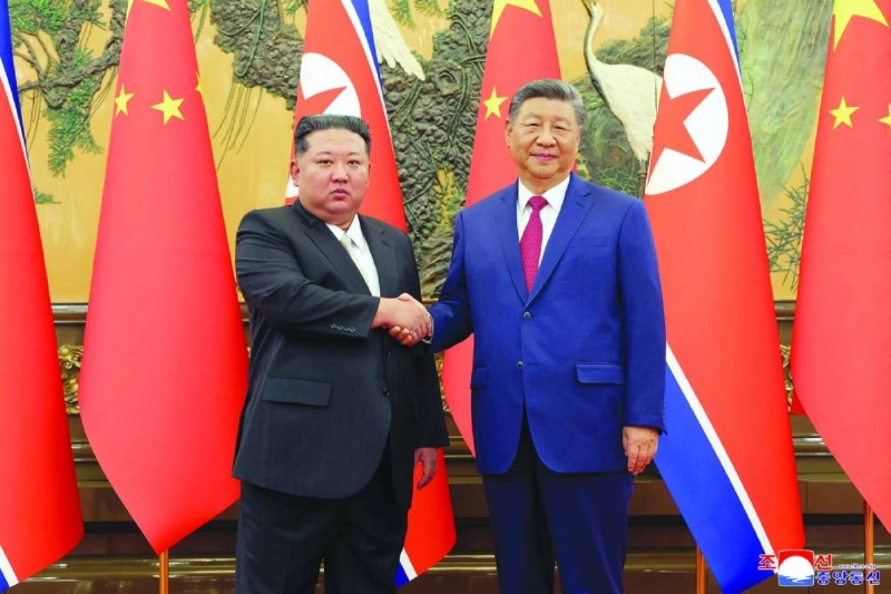 North Korean leader Kim Jong-un shaking hands with Chinese President Xi Jinping in Beijing. (AFP/File Photo)
North Korean leader Kim Jong-un shaking hands with Chinese President Xi Jinping in Beijing. (AFP/File Photo)