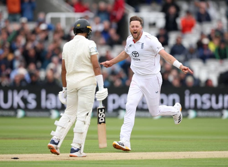 England's Ollie Robinson celebrates after taking the wicket of New Zealand's Rachin Ravindra on the third day of the first Test at Lord's Cricket Ground in London on June 6, 2026. (Reuters)
England's Ollie Robinson celebrates after taking the wicket of New Zealand's Rachin Ravindra on the third day of the first Test at Lord's Cricket Ground in London on June 6, 2026. (Reuters)