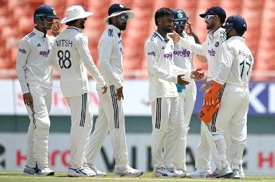 India's Manav Suthar (centre) celebrates with teammates after taking the wicket of Afghanistan's Rahmat Shah during the third day of the one-off Test at the Maharaja Yadavindra Singh International Cricket Stadium on the outskirts of Chandigarh on June 8, 2026. (AFP) India's Manav Suthar (centre) celebrates with teammates after taking the wicket of Afghanistan's Rahmat Shah during the third day of the one-off Test at the Maharaja Yadavindra Singh International Cricket Stadium on the outskirts of Chandigarh on June 8, 2026. (AFP)