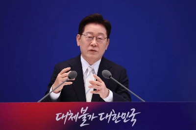 Korean President Lee Jae-myung attends a press conference to mark the first anniversary of his inauguration at the Blue House in Seoul Monday. (AFP) Korean President Lee Jae-myung attends a press conference to mark the first anniversary of his inauguration at the Blue House in Seoul Monday. (AFP)