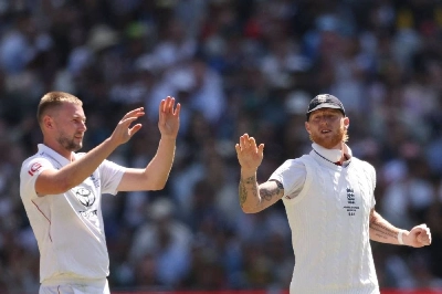 England's Gus Atkinson (left) celebrates the wicket of Australia's Scott Boland with Ben Stokes during the second day of the fourth Ashes Test at the Melbourne Cricket Ground (MCG) in Melbourne, Australia on December 27, 2025. England captain Stokes and team-mate Atkinson are being investigated by the England and Wales Cricket Board (ECB) for a "breach of team protocols" in a nightclub incident after the first Test against New Zealand. (AFP) England's Gus Atkinson (left) celebrates the wicket of Australia's Scott Boland with Ben Stokes during the second day of the fourth Ashes Test at the Melbourne Cricket Ground (MCG) in Melbourne, Australia on December 27, 2025. England captain Stokes and team-mate Atkinson are being investigated by the England and Wales Cricket Board (ECB) for a "breach of team protocols" in a nightclub incident after the first Test against New Zealand. (AFP)