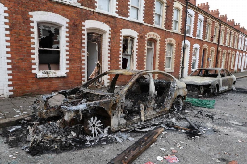 Burnt-out cars and homes are pictured after demonstrations turned violent the night before, in eastern Belfast, Northern Ireland, Wednesday. (AFP) Burnt-out cars and homes are pictured after demonstrations turned violent the night before, in eastern Belfast, Northern Ireland, Wednesday. (AFP)
