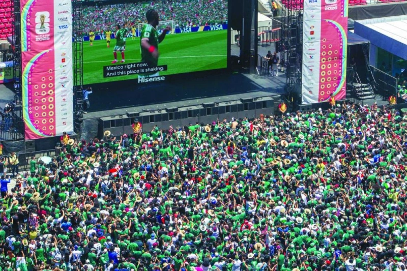 Fans celebrate a goal scored by Julian Quinones as they watch the match between Mexico and South Africa at the Fan Festival in Los Angeles. Fans celebrate a goal scored by Julian Quinones as they watch the match between Mexico and South Africa at the Fan Festival in Los Angeles.