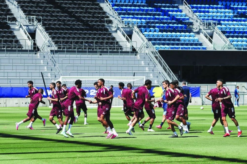Qatar players participate in a drill during a training session. Qatar players participate in a drill during a training session.