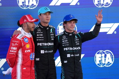 Mercedes' British driver George Russell celebrates pole position with second-placed Ferrari's British driver Lewis Hamilton (left) and third-placed Mercedes' Italian driver Kimi Antonelli (right) after the qualifying session at the Circuit de Catalunya ahead of the Catalonia Grand Prix in Montmelo, on the outskirts of Barcelona, on June 13, 2026. (AFP) Mercedes' British driver George Russell celebrates pole position with second-placed Ferrari's British driver Lewis Hamilton (left) and third-placed Mercedes' Italian driver Kimi Antonelli (right) after the qualifying session at the Circuit de Catalunya ahead of the Catalonia Grand Prix in Montmelo, on the outskirts of Barcelona, on June 13, 2026. (AFP)