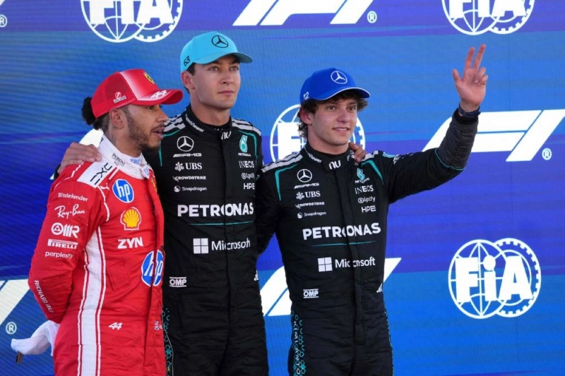 Mercedes' British driver George Russell celebrates pole position with second-placed Ferrari's British driver Lewis Hamilton (left) and third-placed Mercedes' Italian driver Kimi Antonelli (right) after the qualifying session at the Circuit de Catalunya ahead of the Catalonia Grand Prix in Montmelo, on the outskirts of Barcelona, on June 13, 2026. (AFP) Mercedes' British driver George Russell celebrates pole position with second-placed Ferrari's British driver Lewis Hamilton (left) and third-placed Mercedes' Italian driver Kimi Antonelli (right) after the qualifying session at the Circuit de Catalunya ahead of the Catalonia Grand Prix in Montmelo, on the outskirts of Barcelona, on June 13, 2026. (AFP)