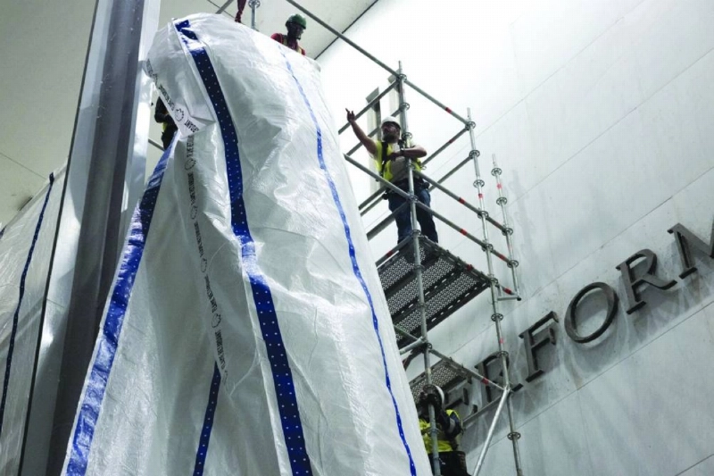 Workers raise a tarp in preparation for the removal of lettering from the facade of the John F. Kennedy Memorial Center for the Performing Arts, following a federal judge’s order to remove U.S. President Donald Trump's name from the institution, in Washington, D.C., U.S., June 13, 2026. REUTERS Workers raise a tarp in preparation for the removal of lettering from the facade of the John F. Kennedy Memorial Center for the Performing Arts, following a federal judge’s order to remove U.S. President Donald Trump's name from the institution, in Washington, D.C., U.S., June 13, 2026. REUTERS