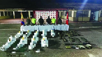 Handout photo partially pixelated before being released by the Colombian Military Forces of military personnel standing in front of the bodies of guerrillas in Nuqui, Choco, Colombia, on June 12, 2026. Nine members of Colombia’s main drug cartel were killed in a military airstrike, the commander of the Armed Forces reported on June 12, 2026, a week and a half before the run-off election pitting the ruling left against the far right. (AFP) Handout photo partially pixelated before being released by the Colombian Military Forces of military personnel standing in front of the bodies of guerrillas in Nuqui, Choco, Colombia, on June 12, 2026. Nine members of Colombia’s main drug cartel were killed in a military airstrike, the commander of the Armed Forces reported on June 12, 2026, a week and a half before the run-off election pitting the ruling left against the far right. (AFP)