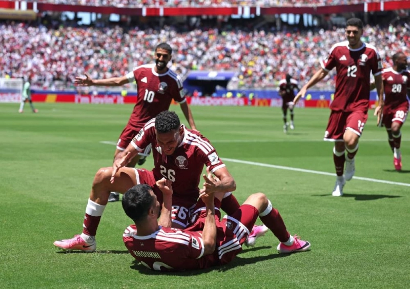 Boualem Khoukhi #16 of Qatar celebrates with teammates after scoring the team's first goal during the FIFA World Cup 2026 Group B match between Qatar and Switzerland at San Francisco Bay Area Stadium on June 13, 2026 in Santa Clara, California. AFP Boualem Khoukhi #16 of Qatar celebrates with teammates after scoring the team's first goal during the FIFA World Cup 2026 Group B match between Qatar and Switzerland at San Francisco Bay Area Stadium on June 13, 2026 in Santa Clara, California. AFP
