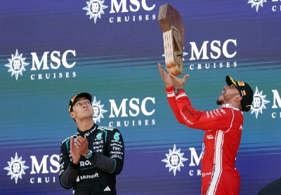 Winner Ferrari's Lewis Hamilton (right) and second placed Mercedes' George Russell celebrate on the podium after the Catalonia Formula One Grand Prix at the Circuit de Catalunya in Montmelo, on the outskirts of Barcelona, on June 14, 2026. (AFP) Winner Ferrari's Lewis Hamilton (right) and second placed Mercedes' George Russell celebrate on the podium after the Catalonia Formula One Grand Prix at the Circuit de Catalunya in Montmelo, on the outskirts of Barcelona, on June 14, 2026. (AFP)