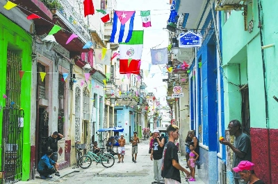 People are seen on a street decorated with flags of Mexico and Cuba in Havana on June 11, 2026, during the World Cup opening match between Mexico and South Africa. (AFP) People are seen on a street decorated with flags of Mexico and Cuba in Havana on June 11, 2026, during the World Cup opening match between Mexico and South Africa. (AFP)