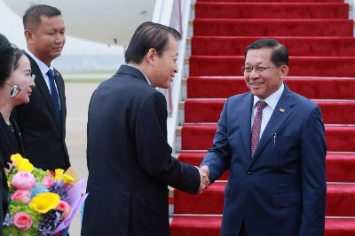 Myanmar’s President Min Aung Hlaing shaking hands with a Chinese official upon his arrival in Beijing. (AFP) Myanmar’s President Min Aung Hlaing shaking hands with a Chinese official upon his arrival in Beijing. (AFP)