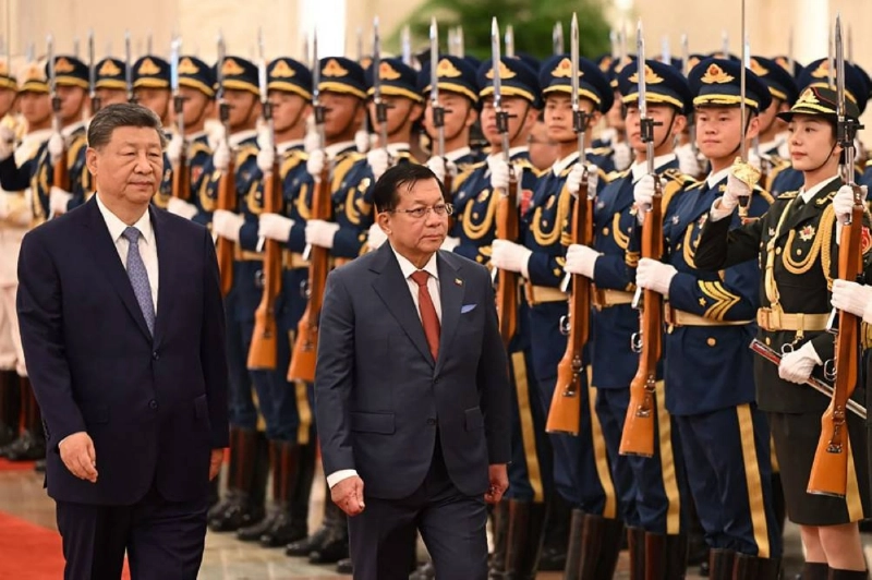 Myanmar's President Min Aung Hlaing and China's President Xi Jinping inspecting a guard of honour during a welcoming ceremony at the Great Hall of the People in Beijing. (AFP) Myanmar's President Min Aung Hlaing and China's President Xi Jinping inspecting a guard of honour during a welcoming ceremony at the Great Hall of the People in Beijing. (AFP)