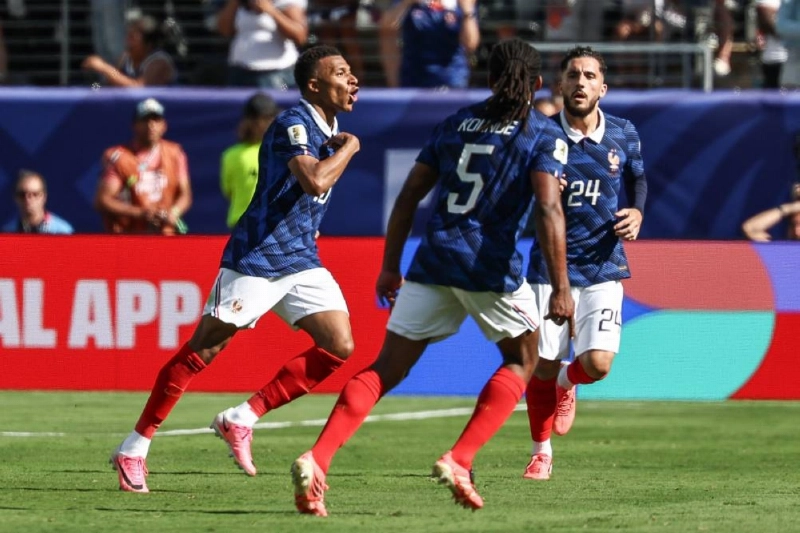 France's forward Kylian Mbappe celebrates with teammates after scoring against Senegal at the New York/New Jersey Stadium in East Rutherford. (AFP) France's forward Kylian Mbappe celebrates with teammates after scoring against Senegal at the New York/New Jersey Stadium in East Rutherford. (AFP)